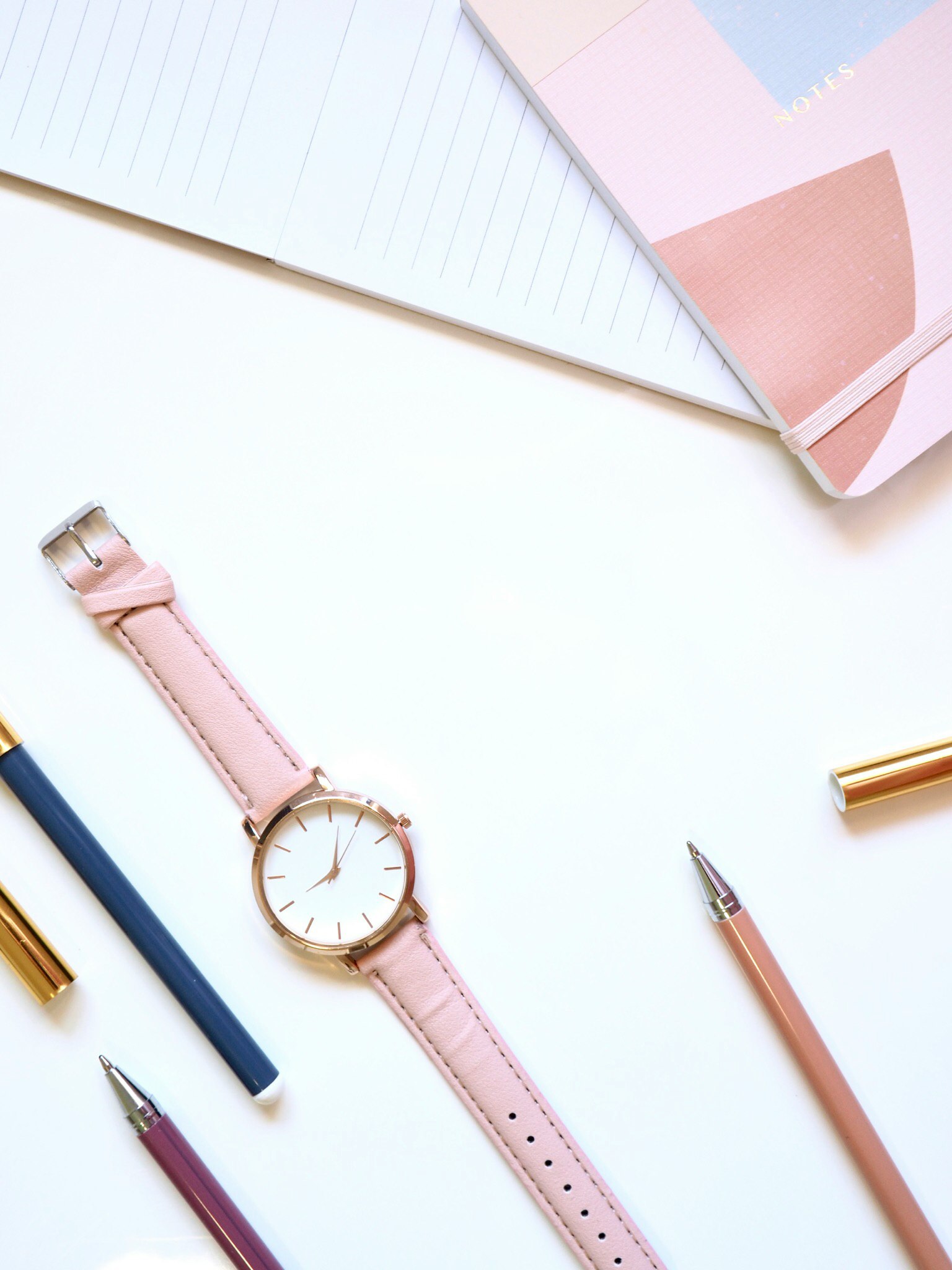 round gold-colored analog watch